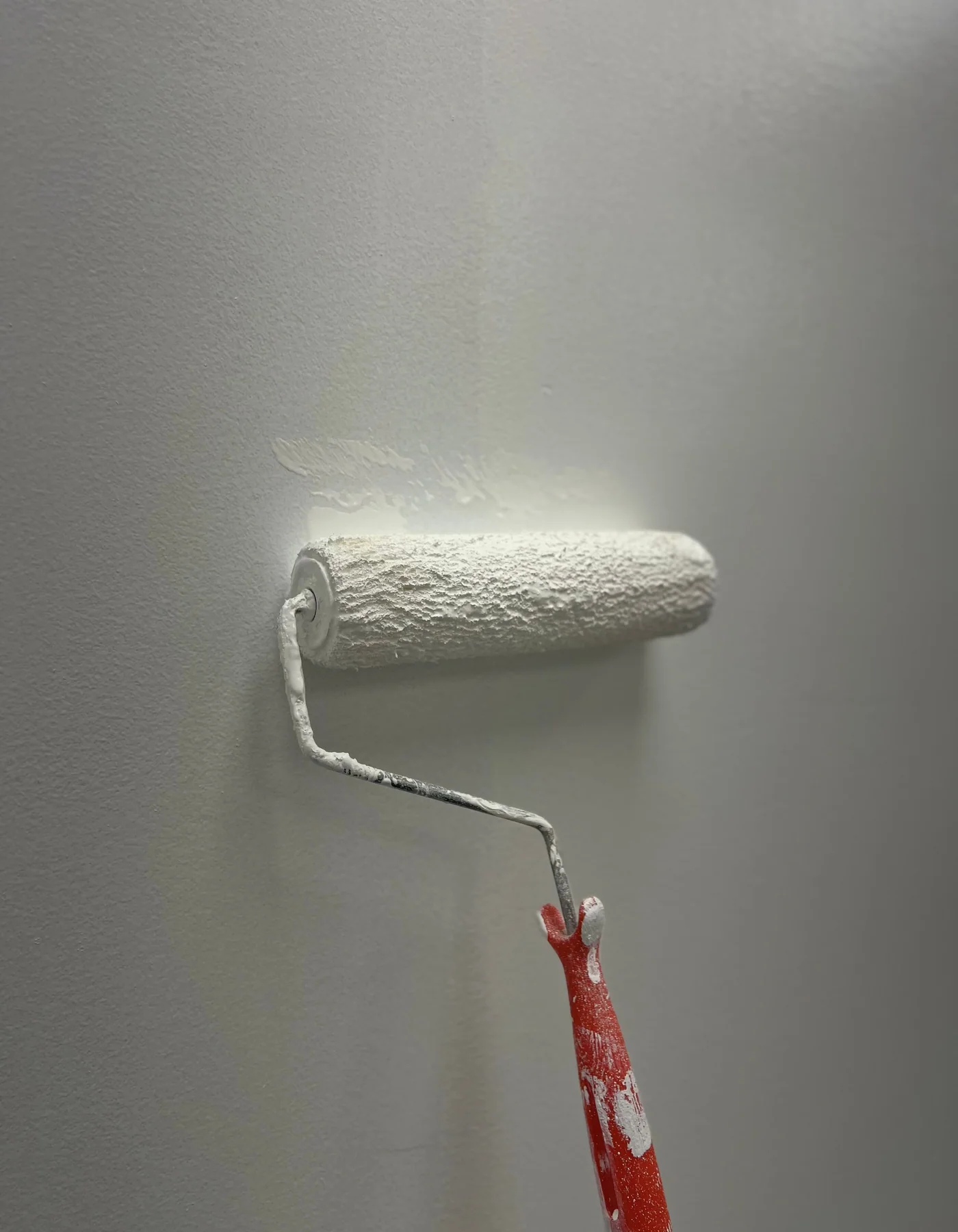 Paint roller nap texture applying paint to a wall surface